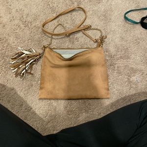 Steve Madden cross body tan color purse.